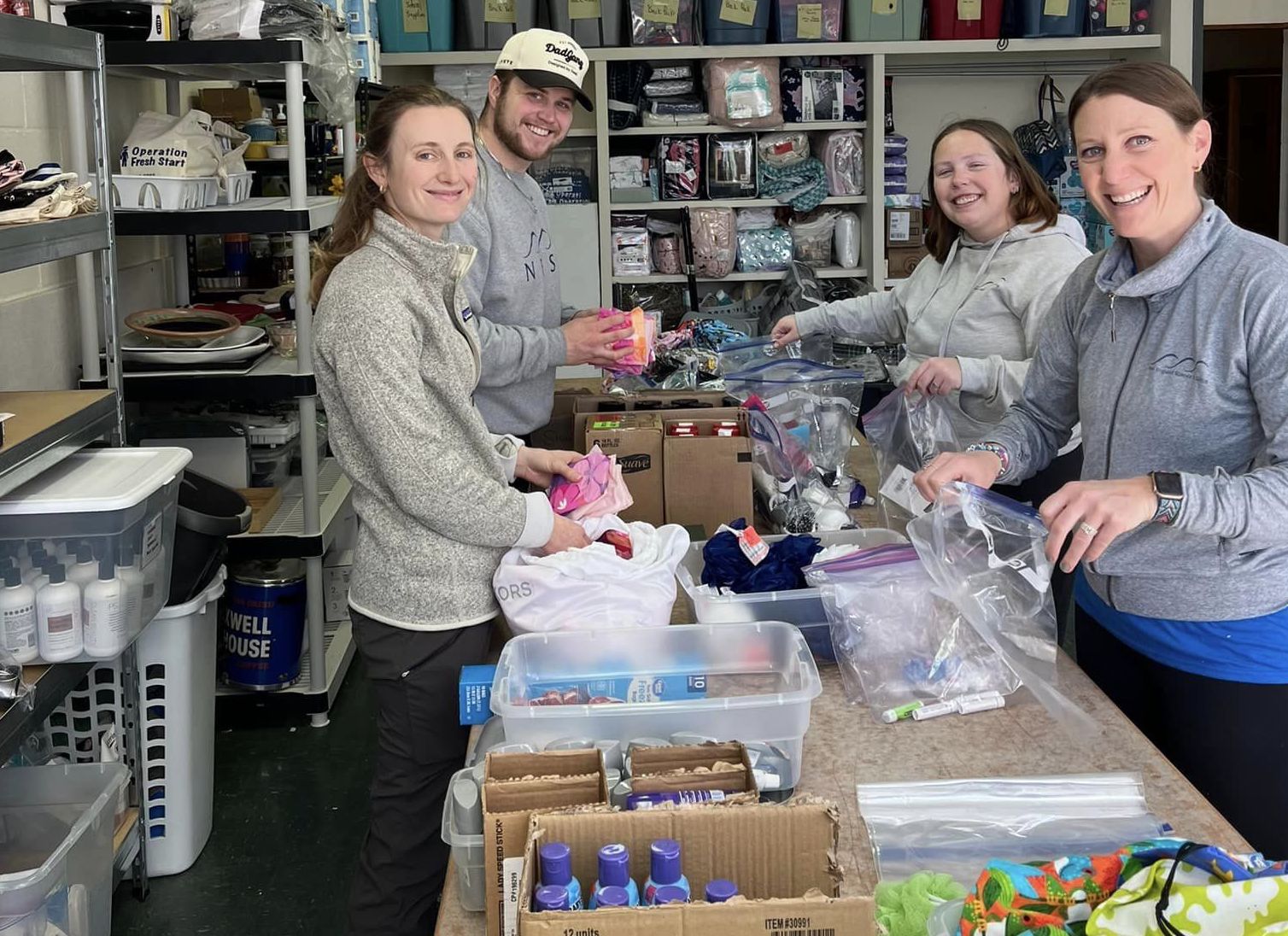 NESS Staff organize donations received by Operation Fresh Start to be given to those in need throughout New London County.